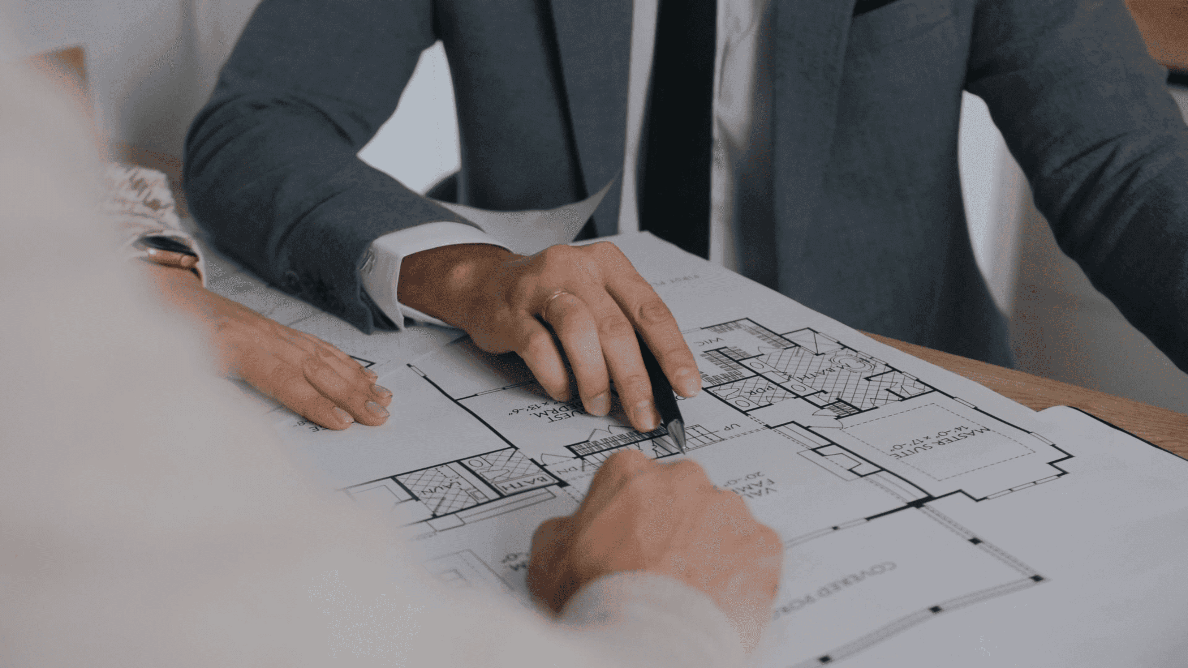 Real estate planning documents on a desk