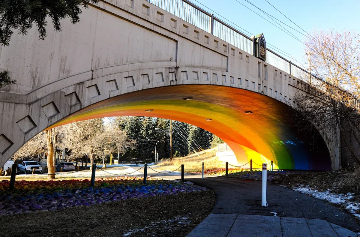 Colorful bridge and river pathway near Riley Park in Kensington, Calgary